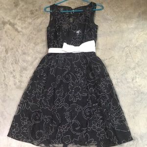 Black lace dress with white bow detail